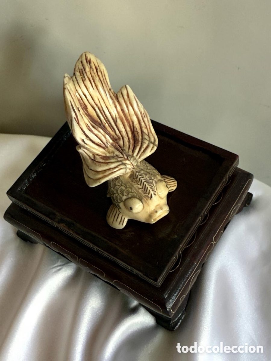 Arte: Escultura pez oriental en marfil