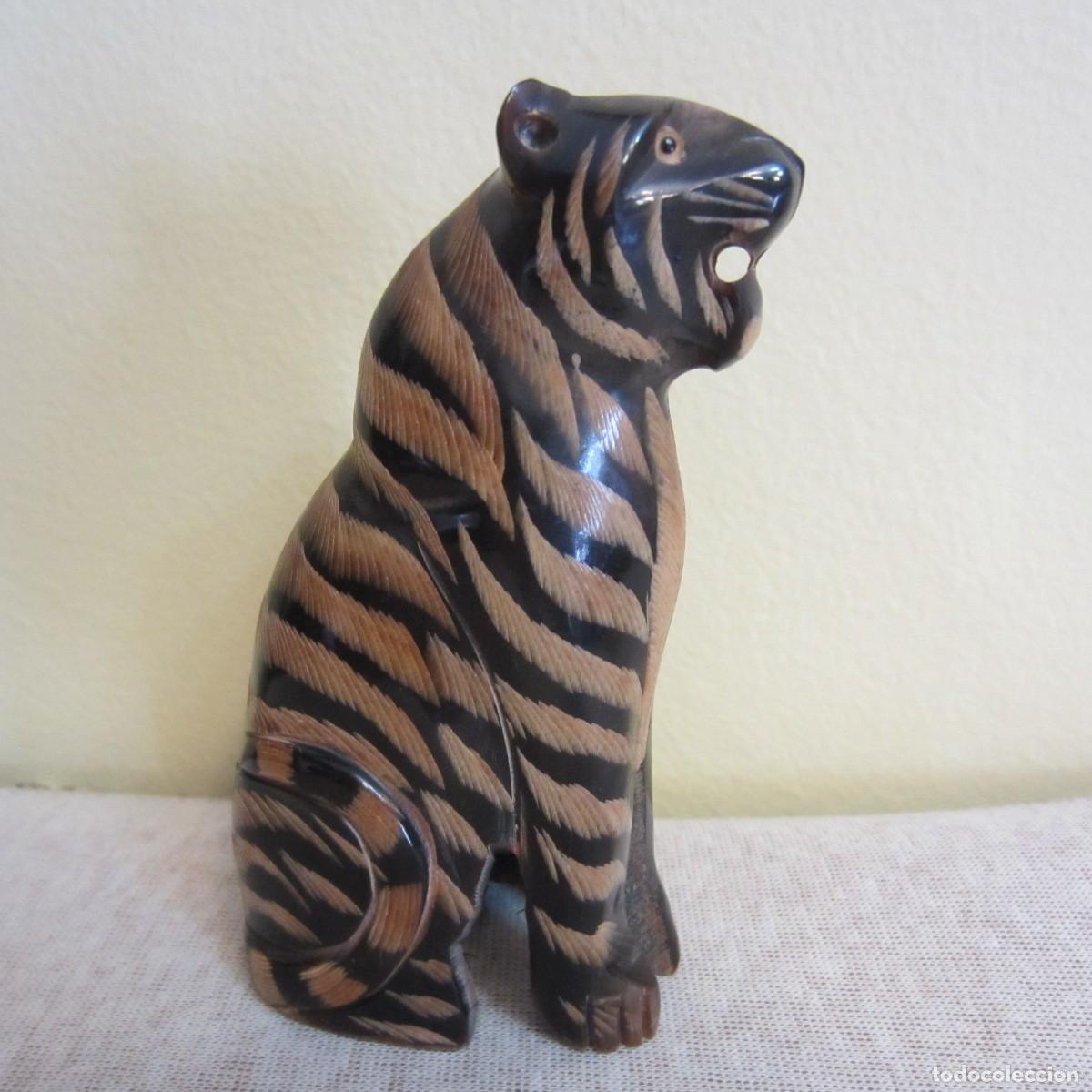 Arte: figura tigre tallado en cuerno