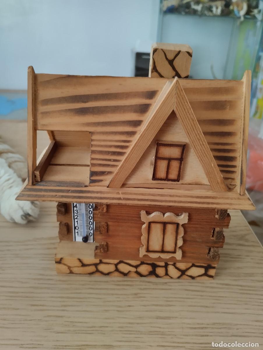 Arte: casita de madera con termometro de polonia
