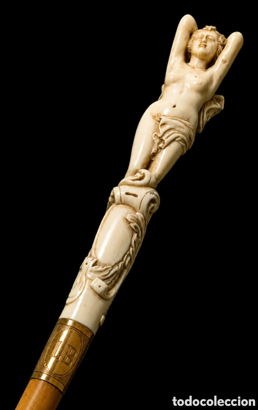 Arte: Baston de lujo con empu&ntilde;adura de marfil tallado a mano y decoracion de oro de 22 k