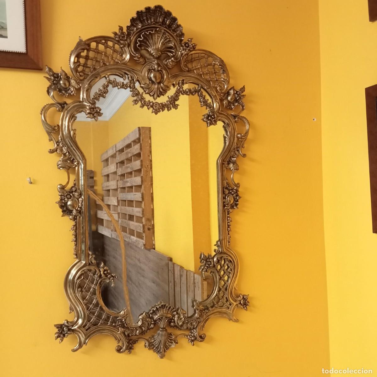 Arte: consola de bronce y espejo a juego