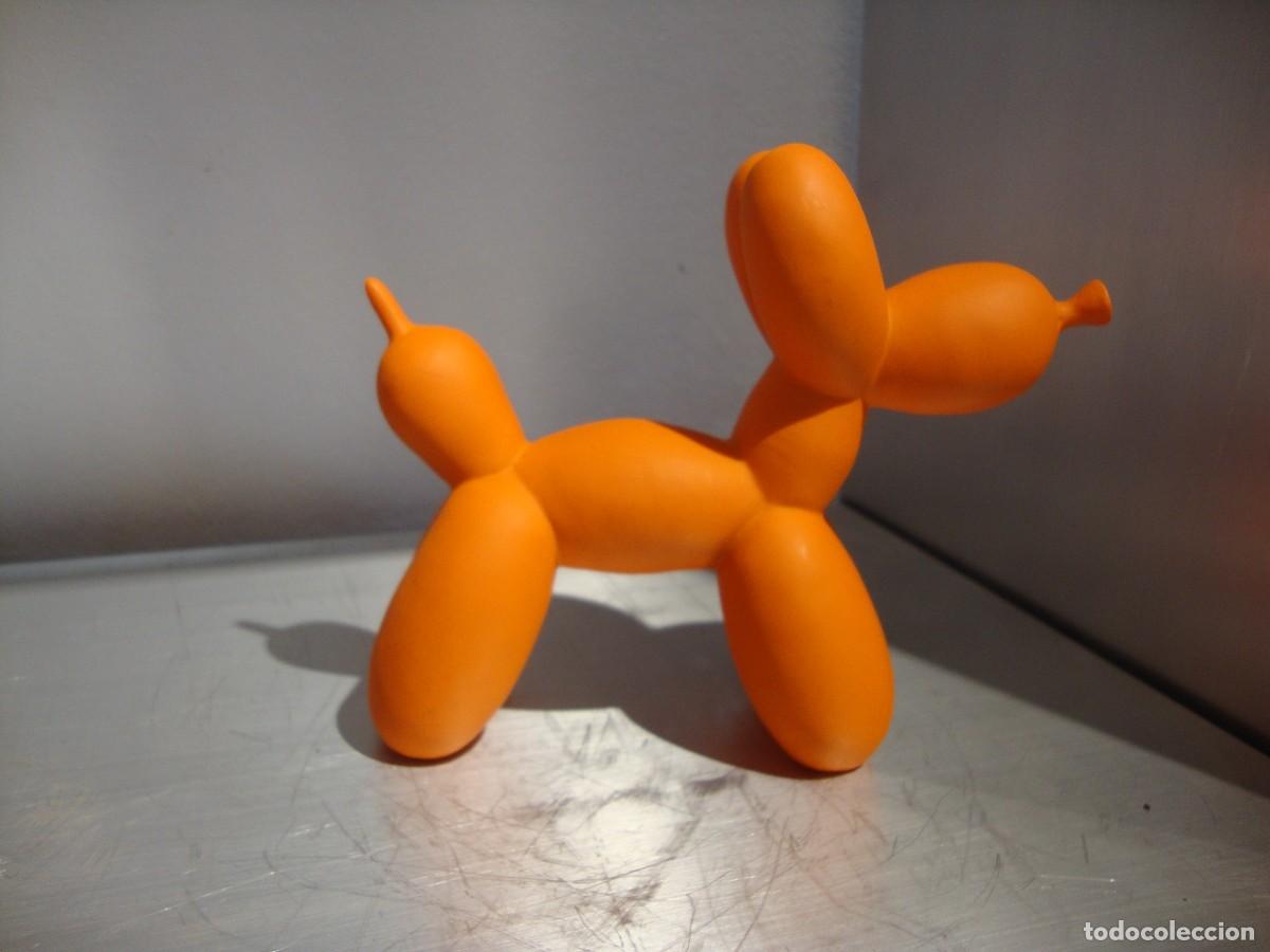 Arte: Perro globo realizado en resina pintada