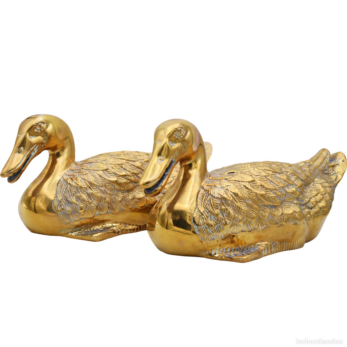 Arte: Patos figuras de bronce