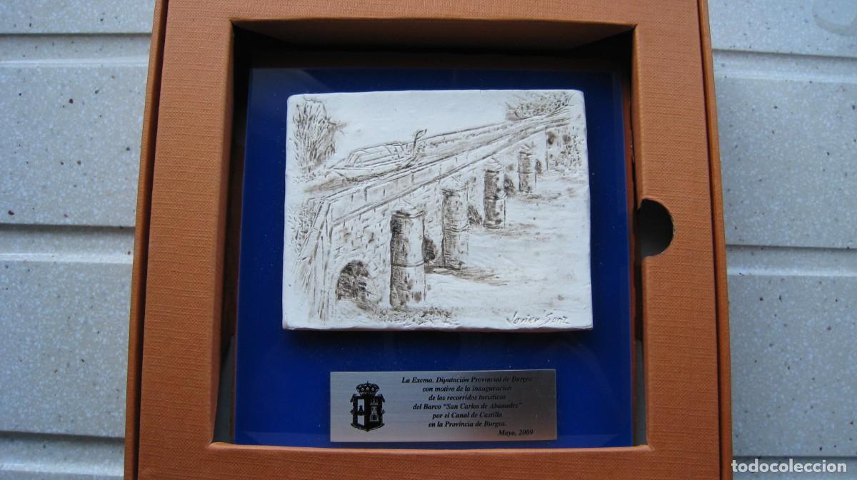 Arte: Grabado en relieve sobre piedra del canal de Castilla encargado al l famoso escultor Javier Sanz por