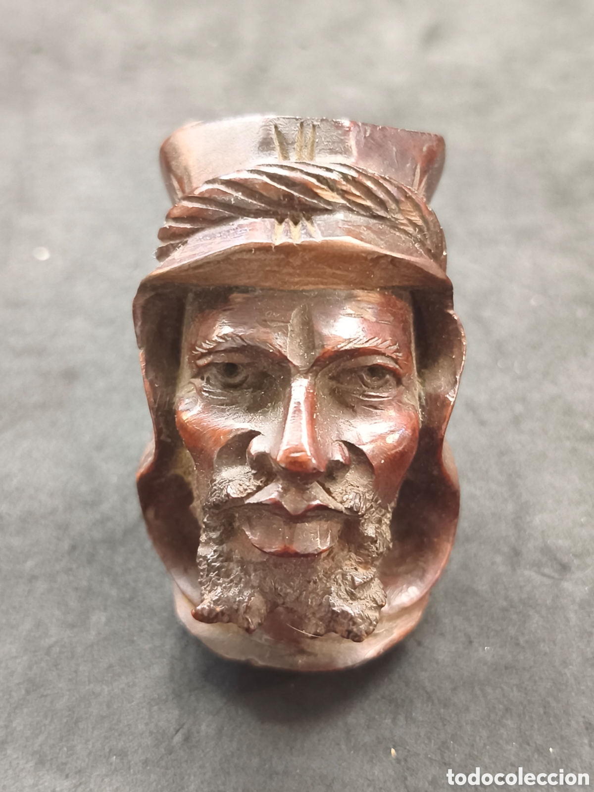 Arte: Cara tallada en madera posible empu&ntilde;adura de paraguas o baston
