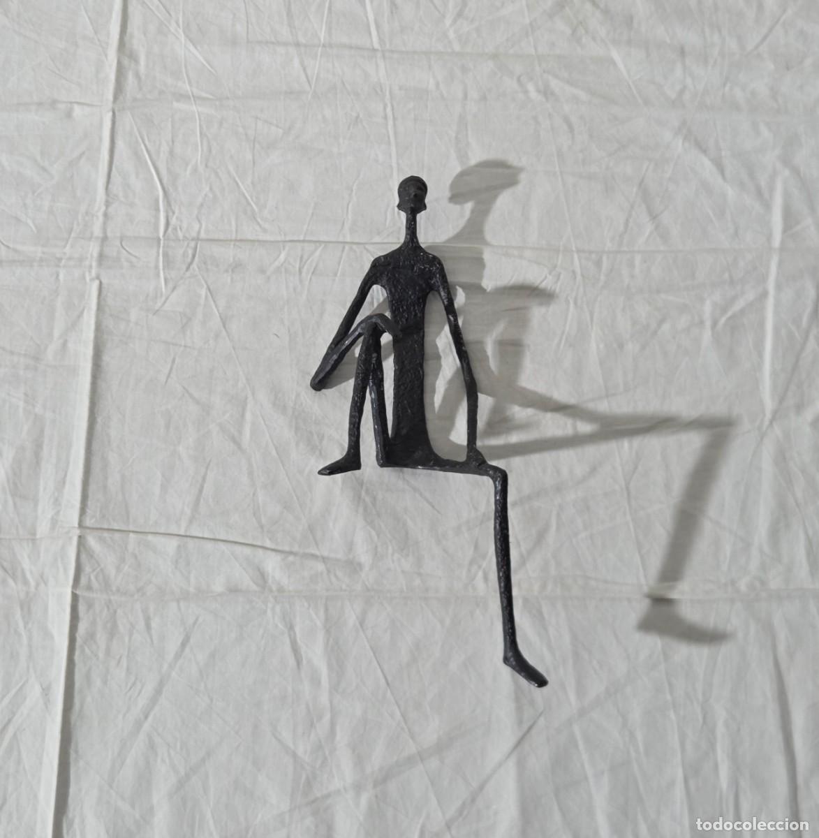 Arte: Figura de Africano sentado en hierro