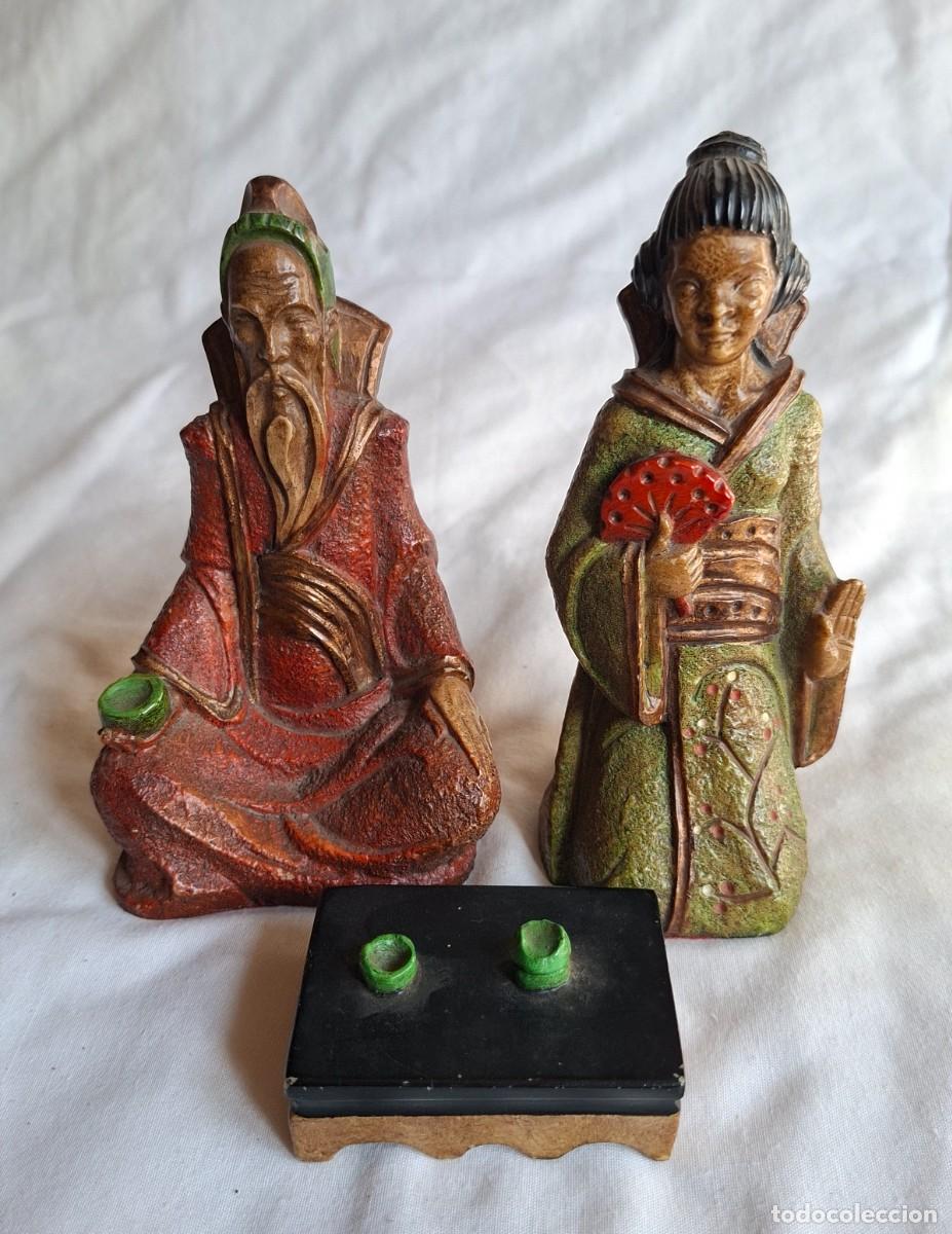 Art: figuras representa a un sabio anciano y una geisha o dama oriental,
