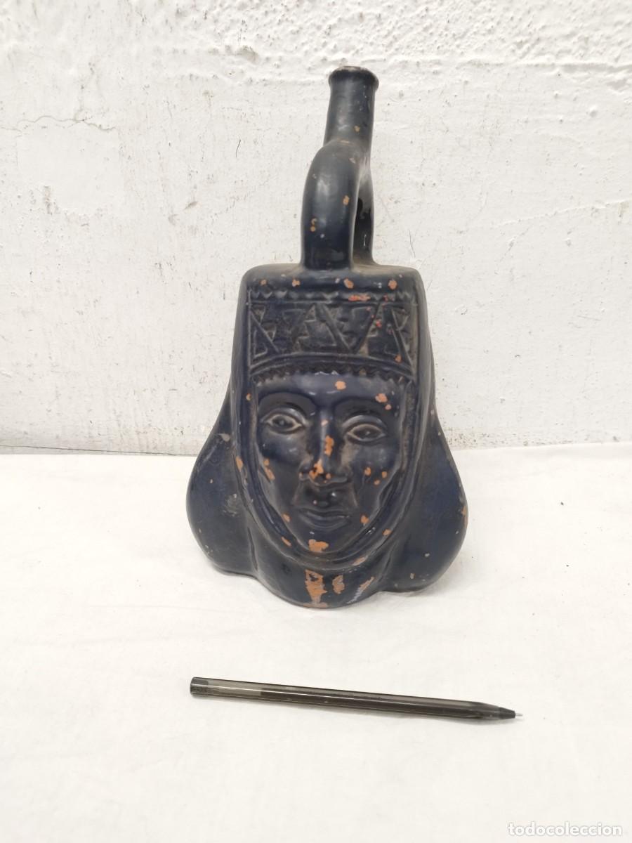Arte: Botella o escultura de cer&aacute;mica forma de cabeza. Tipo precolombina de mediados mediados sg. XX.