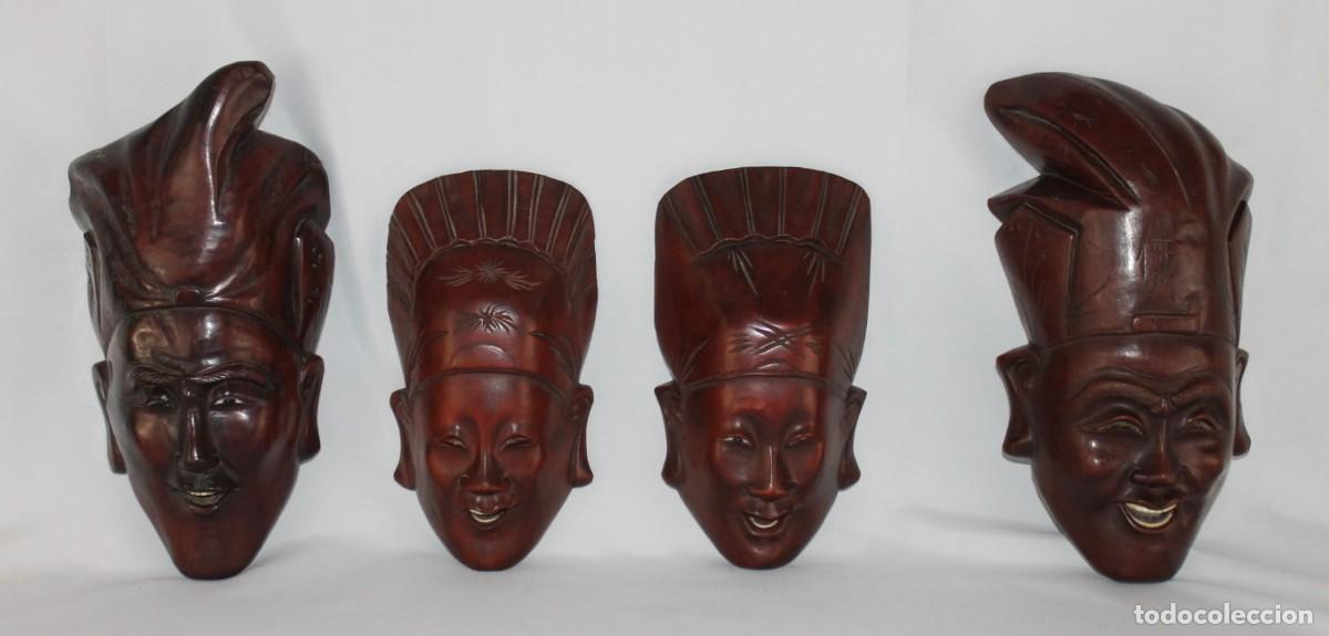 Arte: Conjunto de 4 m&aacute;scaras orientales talladas en madera de palisandro con incrustaciones de hueso
