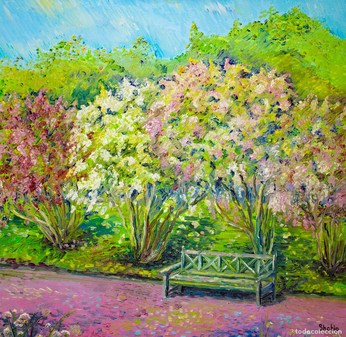 Cuadro Bench in the lilac park .