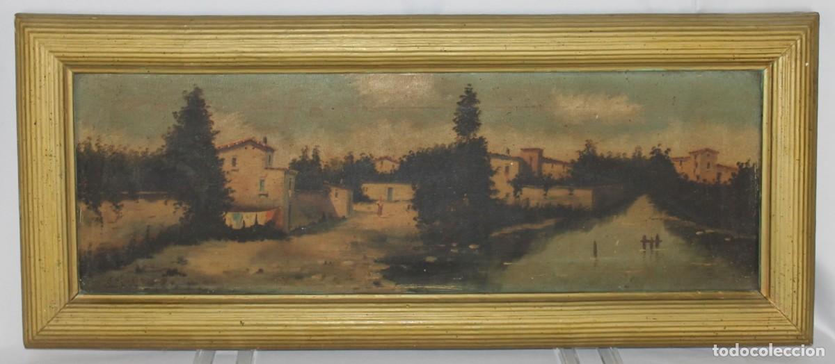 Arte: &Oacute;leo sobre lienzo. Paisaje con casas y r&iacute;o. Principios del siglo XX. Firmado A. Su&aacute;rez