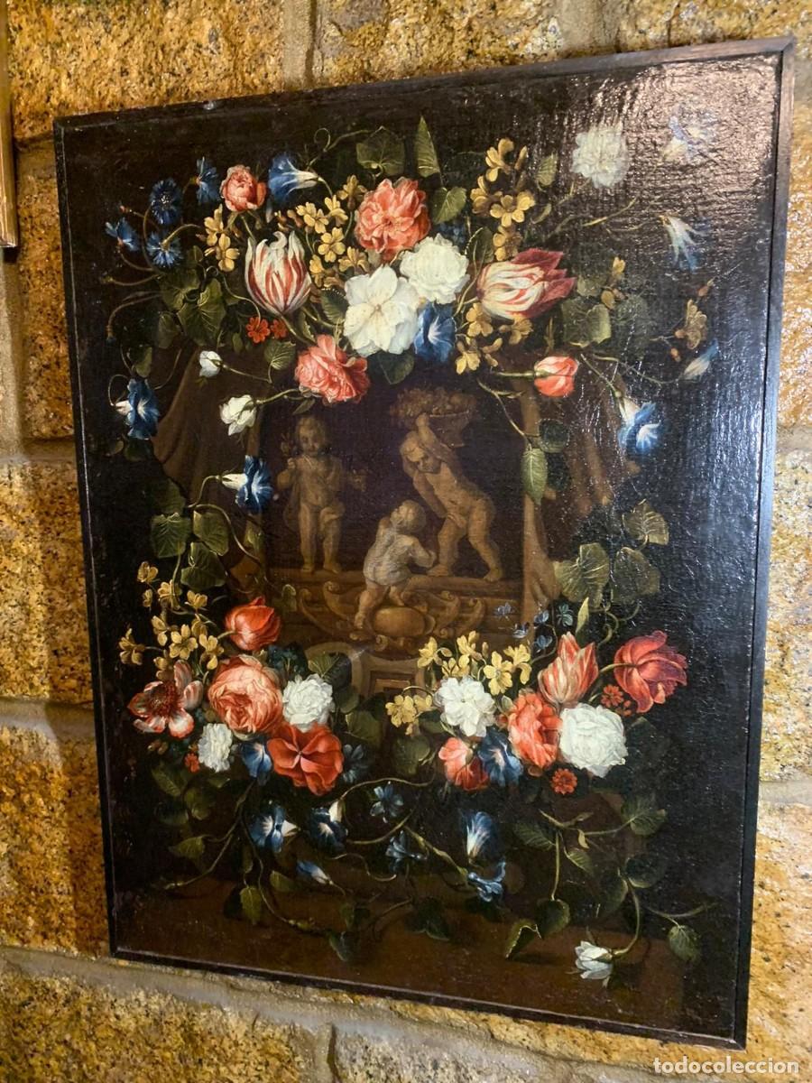 Arte: Abraham Brueghel (Attrib.) Three sweethearts in a garland of flowers (Antweres, 1631-90)