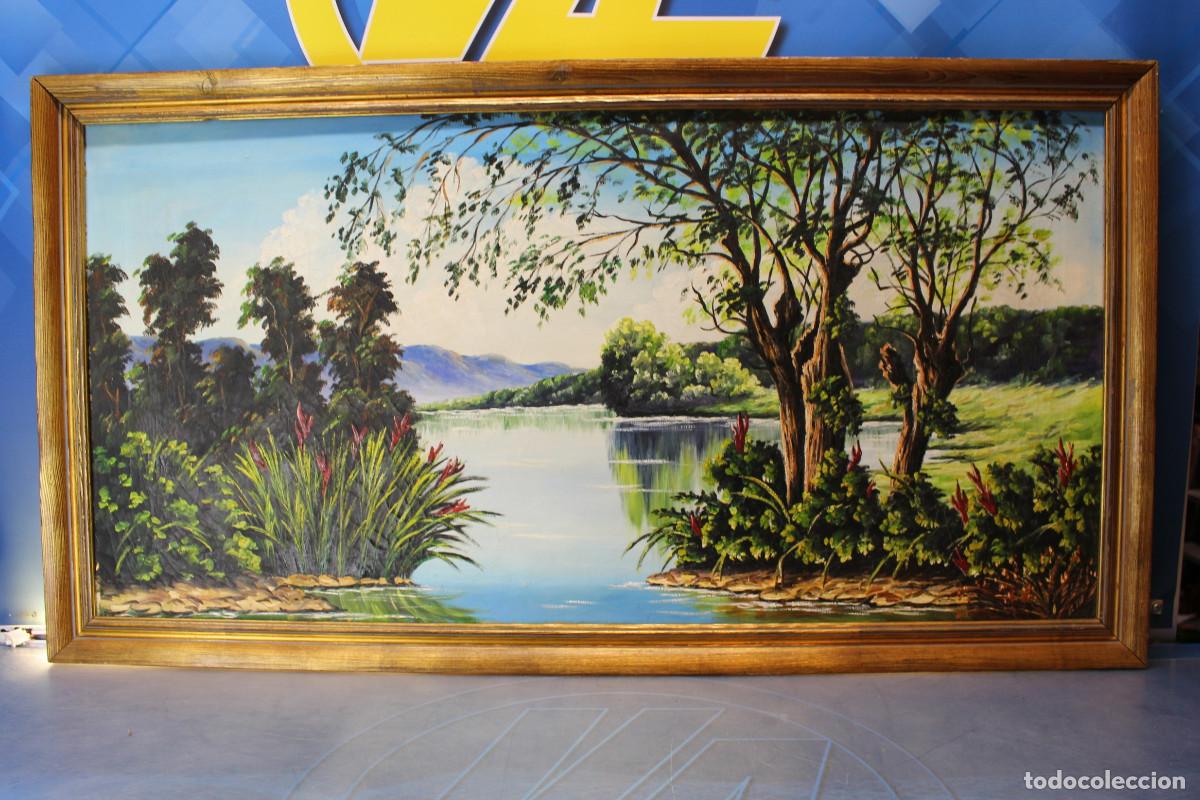 Arte: 14. &Oacute;leo sobre lienzo. Paisaje con r&iacute;o. Sin firma.