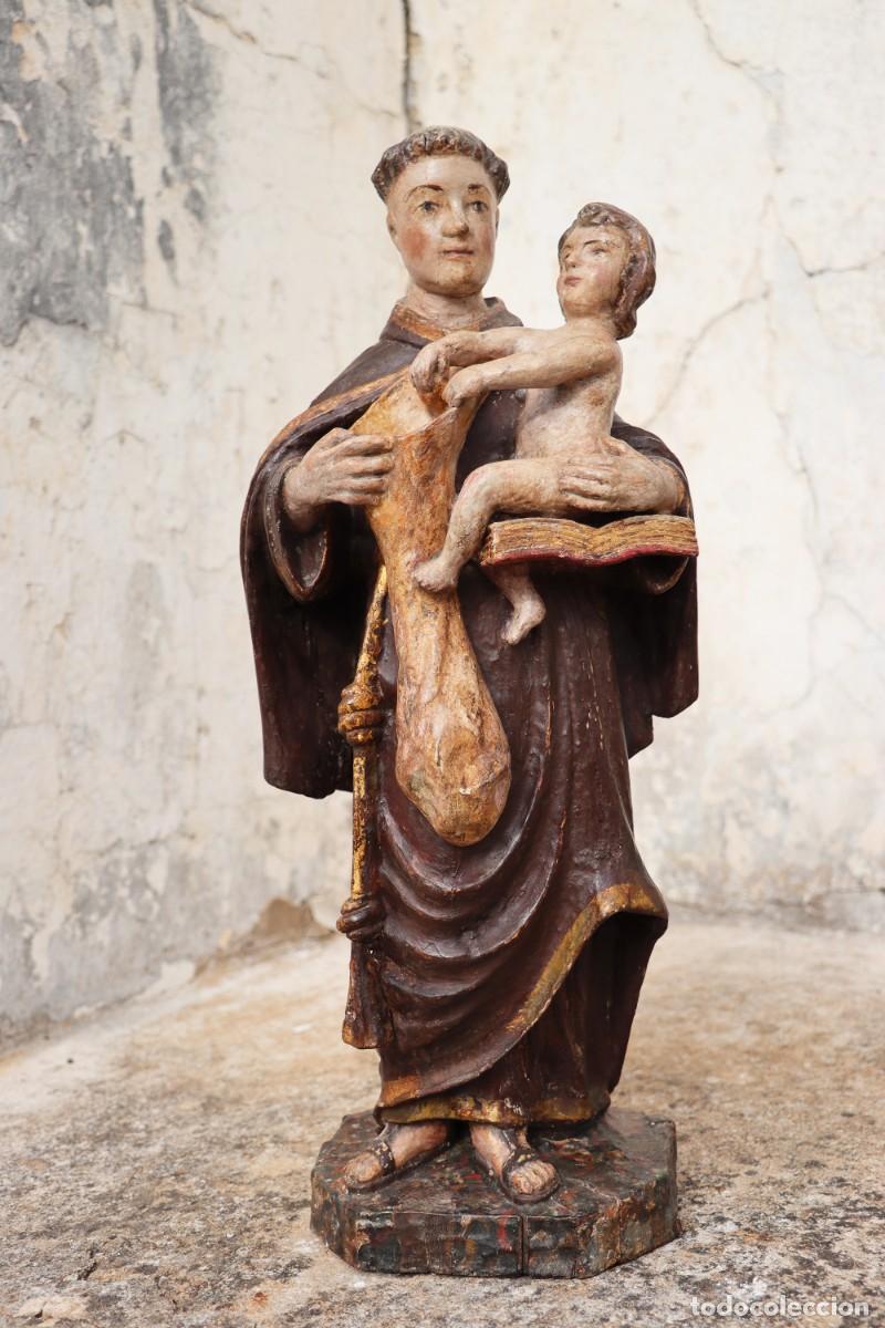 Kunst: San Antonio con el Ni&ntilde;o Jes&uacute;s, sosteniendo una bolsa para la distribuci&oacute;n de pan a los pobres