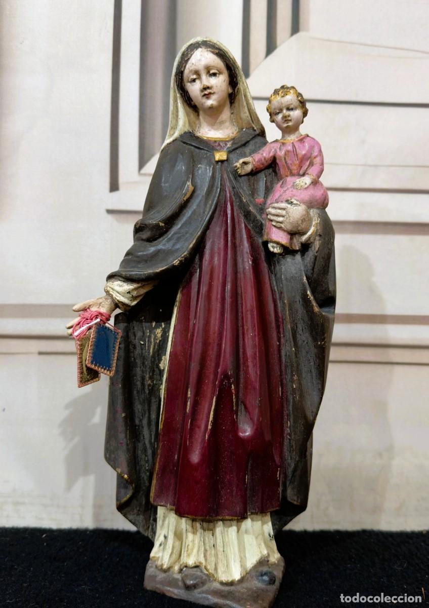 Arte: Talla religiosa de madera que representa a la Virgen Mar&iacute;a sosteniendo al Ni&ntilde;o Jes&uacute;s S.XVIII