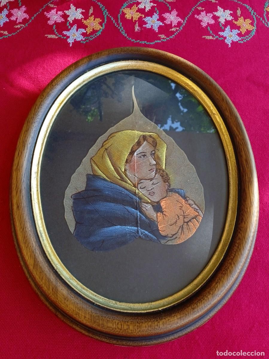 Arte: Marco ovalado con pintura religiosa sobre hoja natural