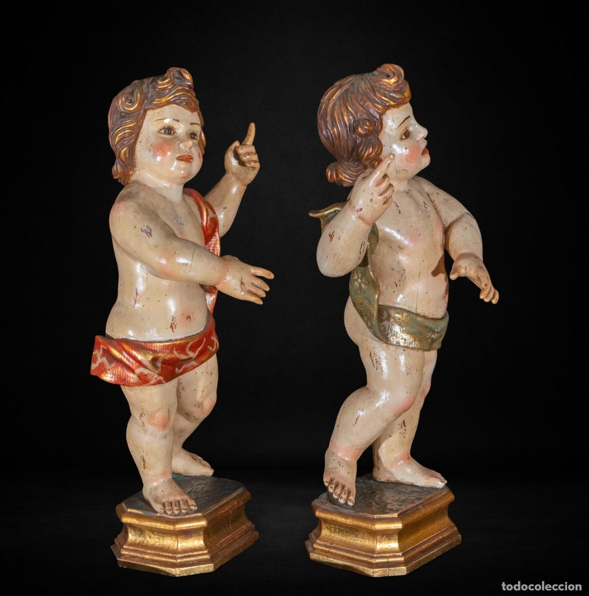 Arte: Pareja de putti en madera tallada policromada. Escuela espa&ntilde;ola, siglo XIX