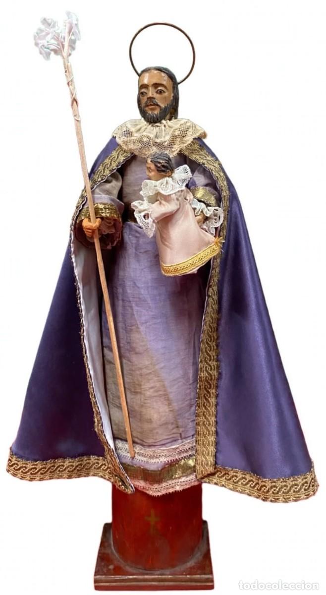 Arte: Antiguo San Jos&eacute; cap i pota, talla de madera con el ni&ntilde;o Jes&uacute;s y peana de madera. XIX. 45x25x10