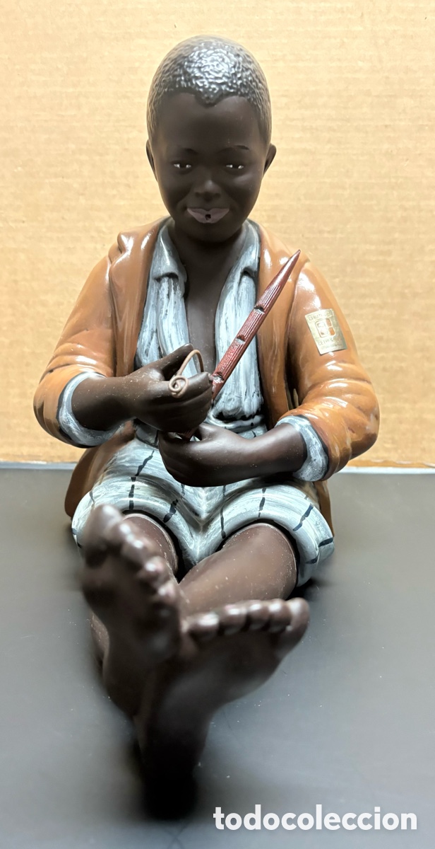 Arte: Figura de cer&aacute;mica ni&ntilde;o tocando la flauta