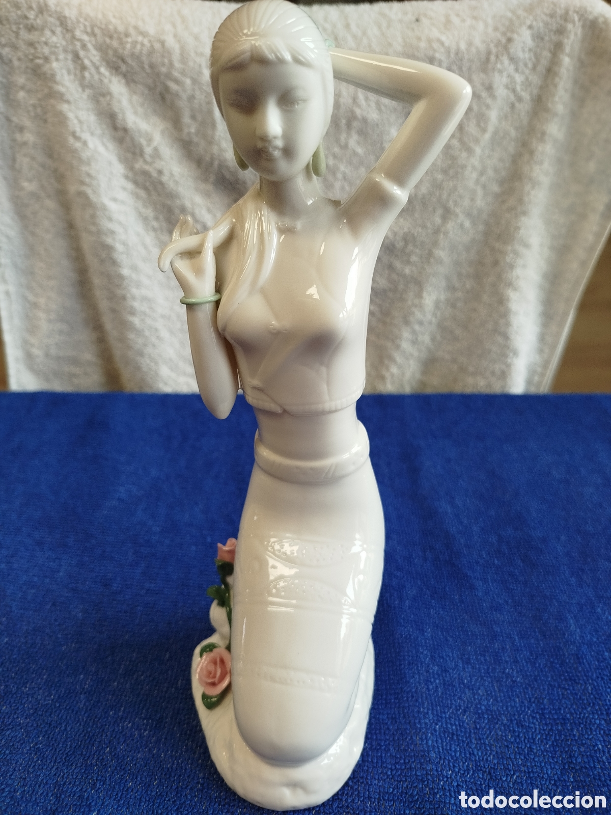Artesan&iacute;a: Figura de mujer en porcelana fina de Tailandia.