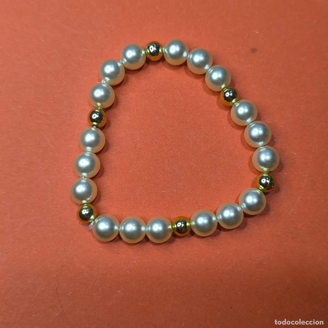 Artesan&iacute;a: 001505COM-pulsera el&aacute;stica de cuentas blancas y doradas