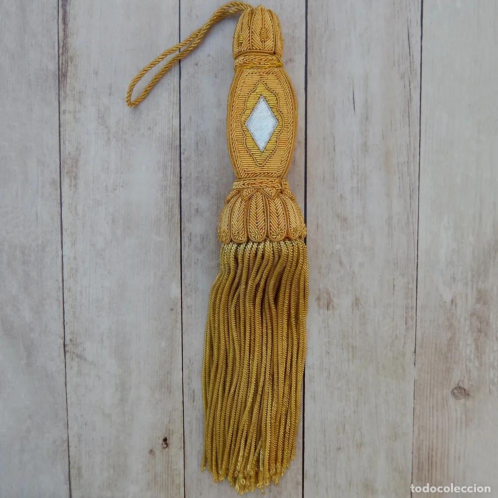 Artisanat: Borla sin rango de oro para faj&iacute;n