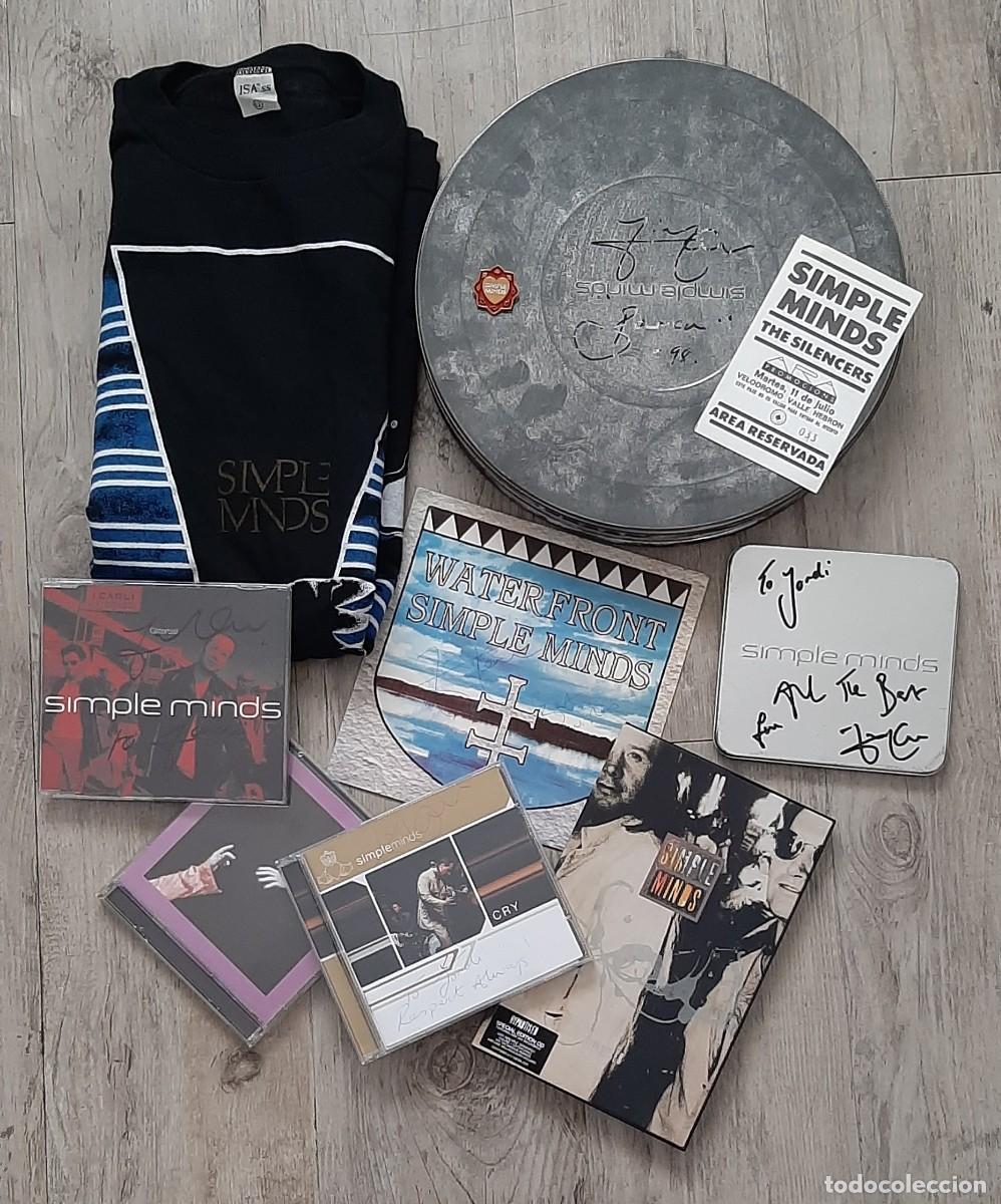 Aut&oacute;grafos antiguos de cantantes y m&uacute;sicos: SIMPLE MINDS &ndash; &lsquo;&rsquo;N&Eacute;APOLIS / CD / MERCH&rsquo;&rsquo; &ndash; FIRMADO.