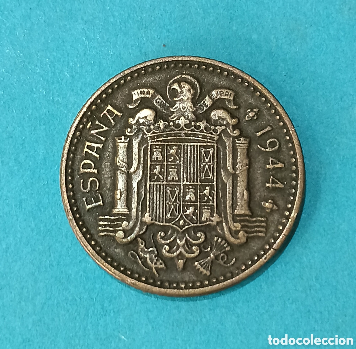 Billetes con errores: 1 Peseta 1944 Estado Espa&ntilde;ol con error de acu&ntilde;aci&oacute;n ( Exceso Metal Columna PLVS). M&aacute;s monedas Perfil