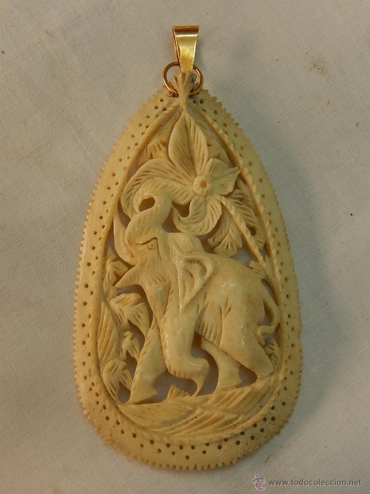 Joyeria: Colgante de la suerte. Oro y hueso. - Foto 1
