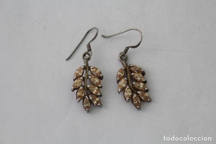 Joaillerie: pendientes en plata de ley con piedras amarillas