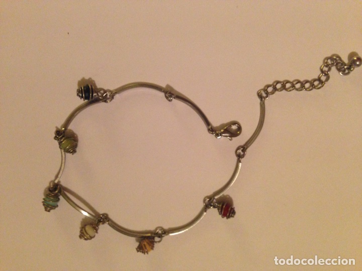 Joaillerie: Pulsera en Acero, con Pi&ntilde;as de colores, de peque&ntilde;o tama&ntilde;o