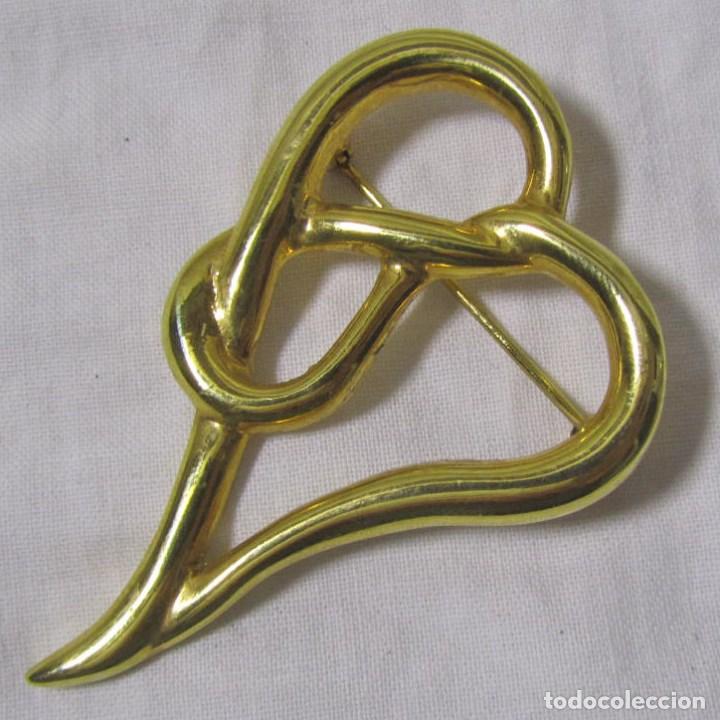 Gioielleria: Broche de metal dorado Tic Rack Made in England