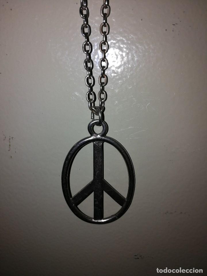 Joalharia: COLGANTE CON SIMBOLO HIPPIE