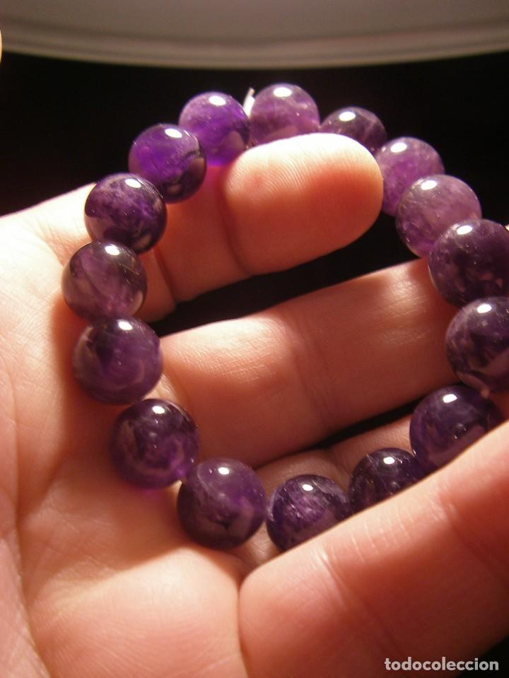 Gioielleria: Pulsera de Amatista de bolas de 12 mm engarzadas con cord&oacute;n el&aacute;stico sin nudos intermedios.