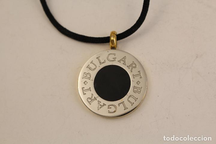 Joyeria: colgante en acero y nacar con cordon negro