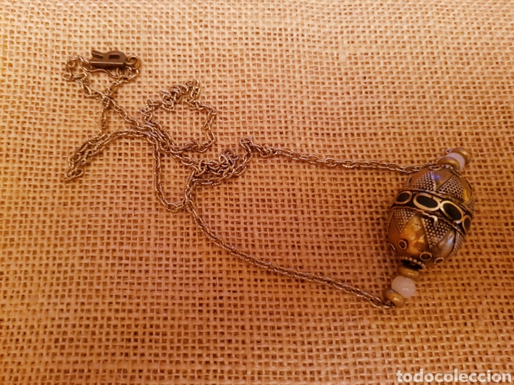Joalharia: Colgante largo con bola afgana labrada en alpaca y bronce.