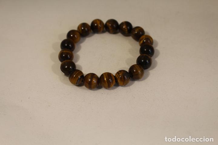 Joyeria: Pulsera de ojo de tigre bola 10mm