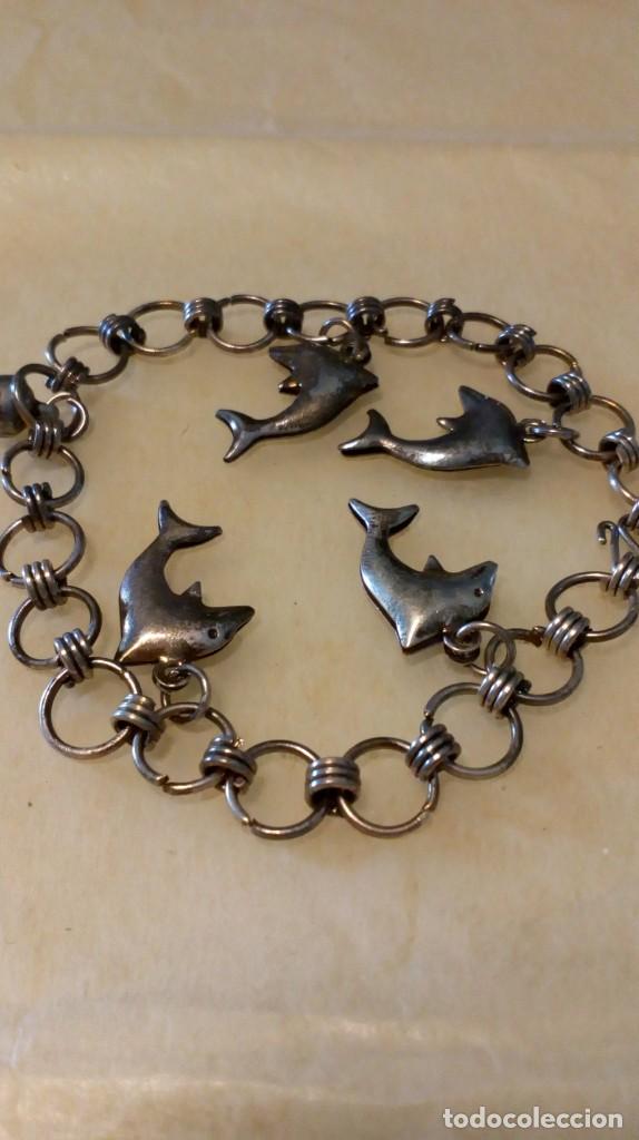 Joyeria: Pulsera plateada de delfines