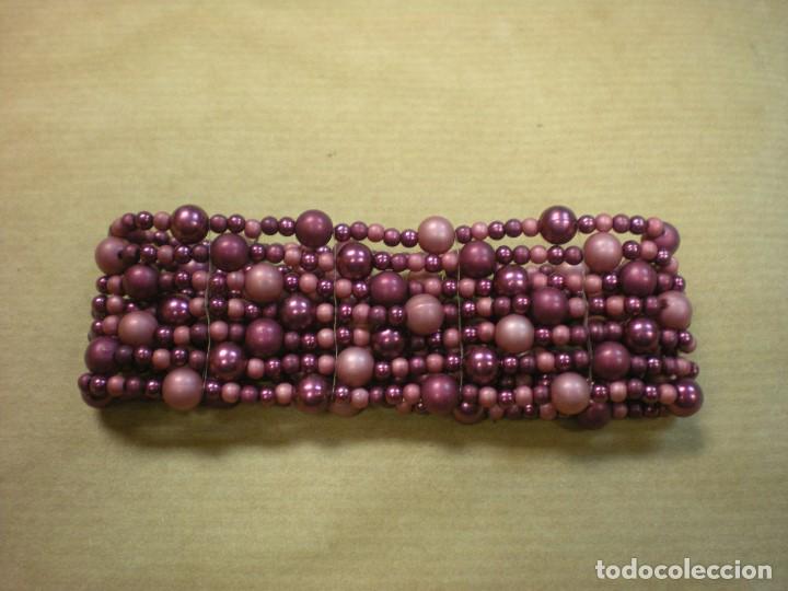 Joyeria: PULSERA EXTENSIBLE CON CUENTAS MORADAS DIVERSOS TAMA&Ntilde;OS - Foto 1