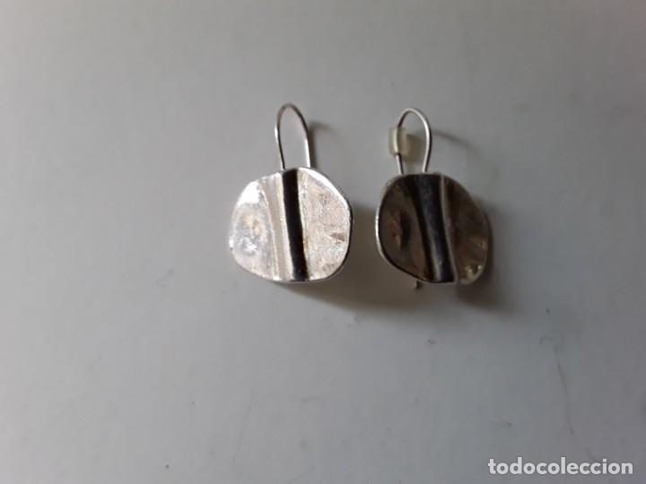 Gioielleria: Pendientes de metal plateado. Medidas: 2 cm de di&aacute;metro aprox