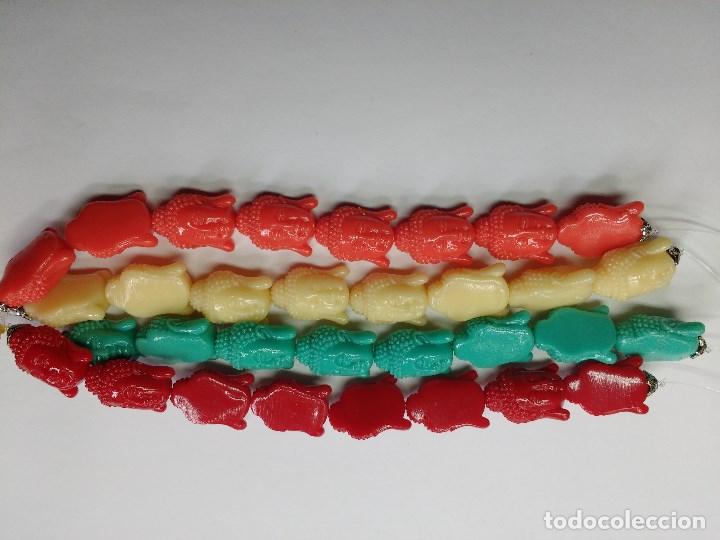 Gioielleria: TIRAS CABEZAS DE BUDA DE COLORES EN RESINA.
