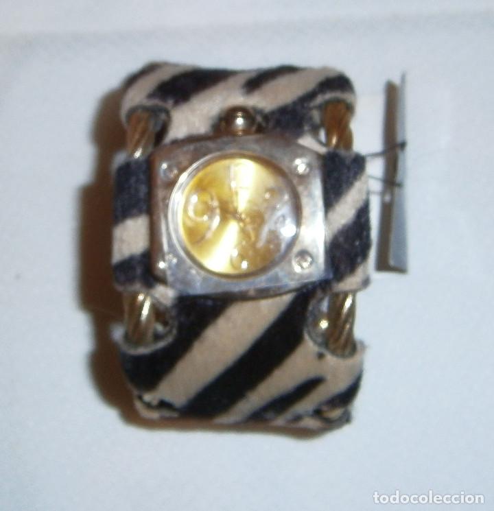 Joaillerie: bonita pulsera adaptable con reloj de metal dorado y tela nueva