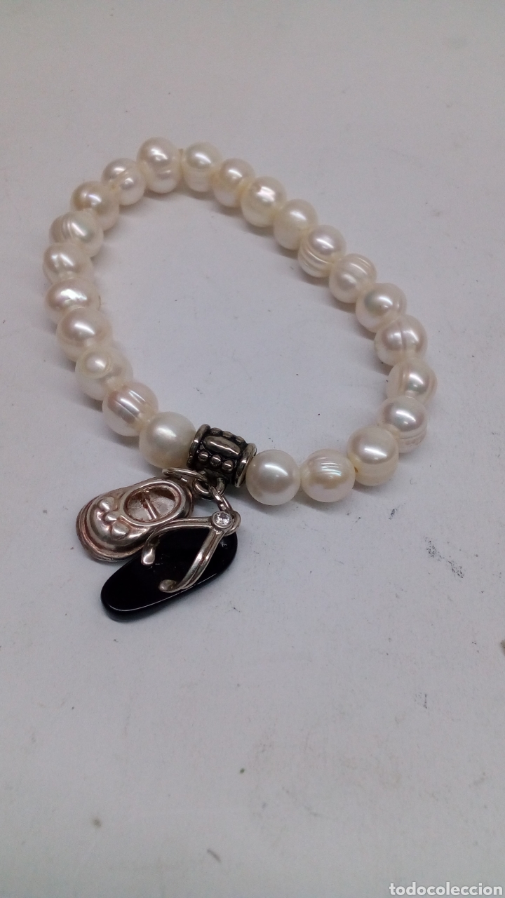 Gioielleria: Pulsera perlas y motivos de plata