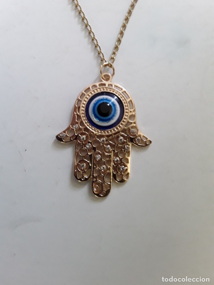 Joaillerie: Colgante de la Mano de F&aacute;tima en metal dorado con ojo turco