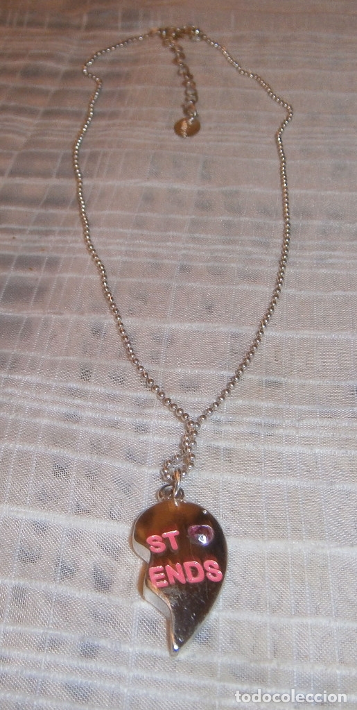 Gioielleria: colgante medio corazon con cadena plateada