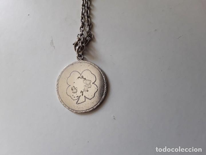 Joaillerie: Colgante amuleto de plata de la doble suerte,en una cara un tr&eacute;bol de 4 hojas, en otra una herradura