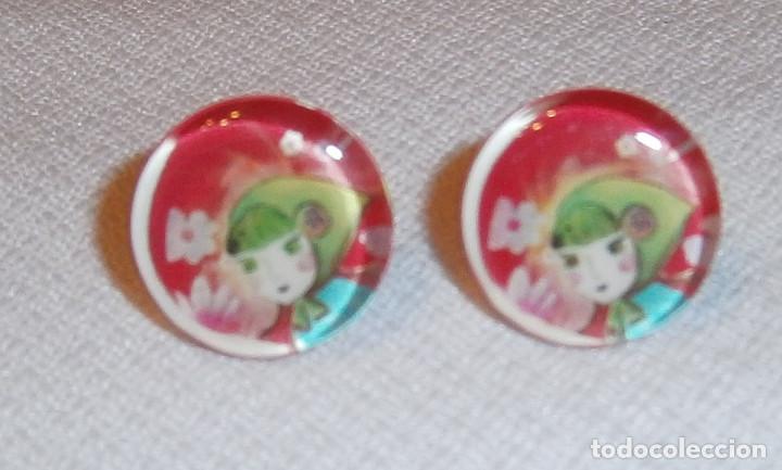 Joyeria: pendientes redondos de cristal con una cara en el interior - Foto 1