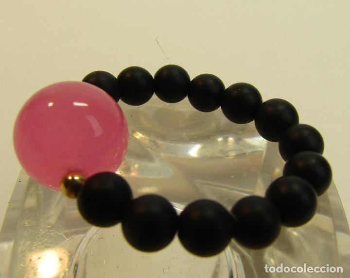 Joyeria: ANILLO EL&Aacute;STICO CON BOLAS LISAS EN ROSA Y NEGRO - Foto 1