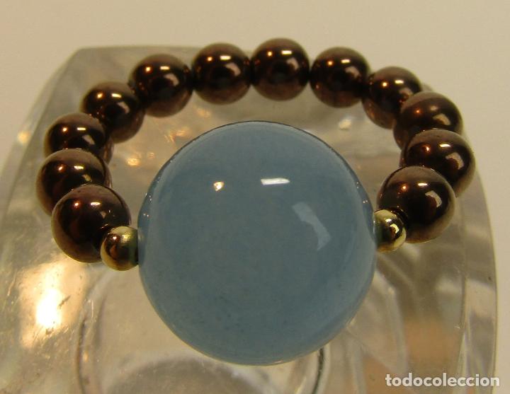 Joyeria: ANILLO EL&Aacute;STICO CON BOLAS LISAS EN AZUL Y BRONCE - Foto 1