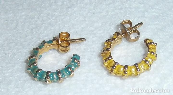 Gioielleria: pendientes de medio aro de diferentes colores